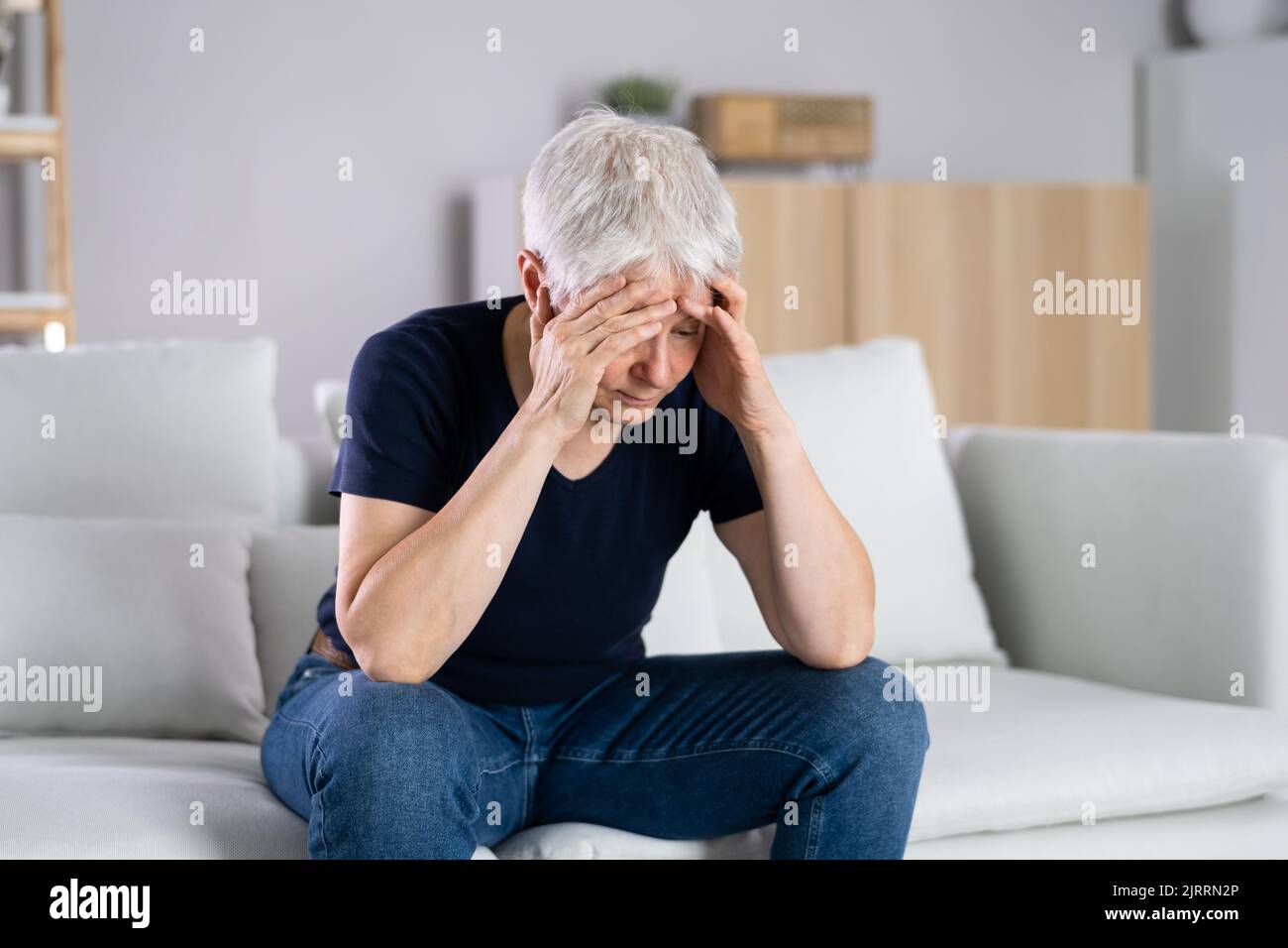 Worried Woman With Mental Stress. Sad Bored Elder person Stock Photo