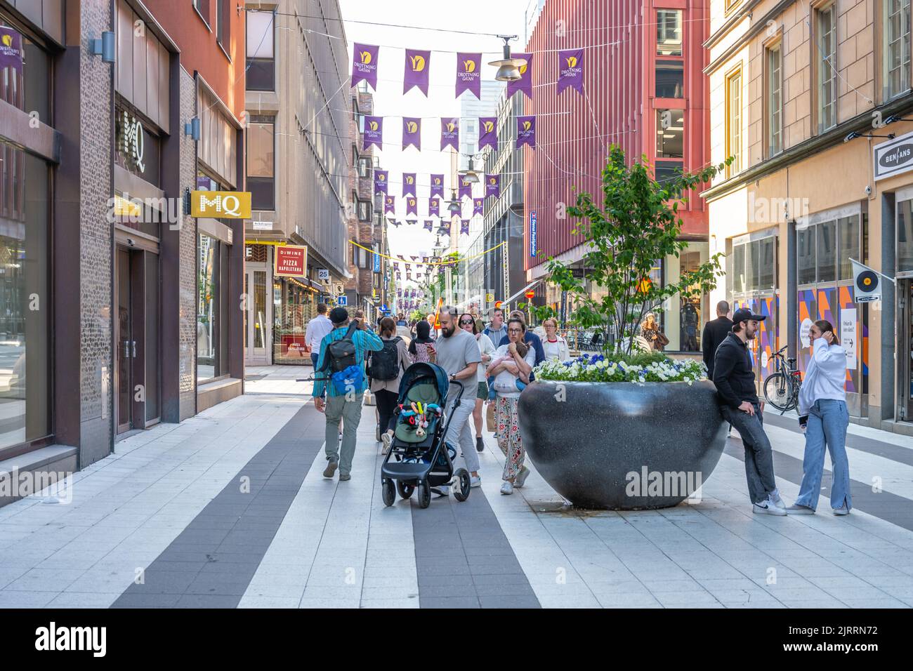 People shopping on Drottninggatan Street in Stockholm Stock Photo