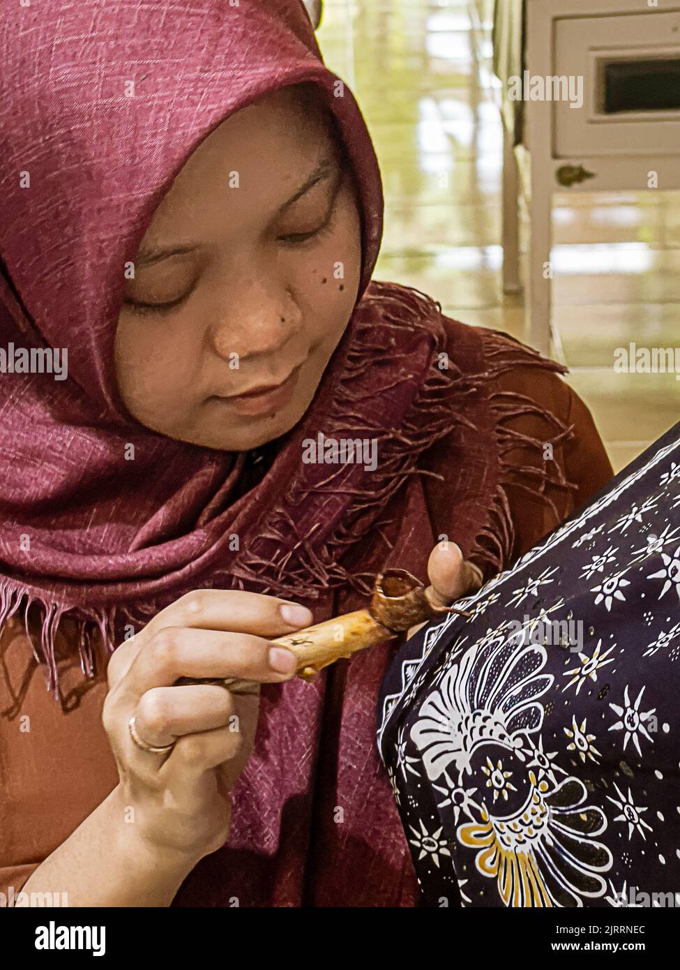 Indonesia, June 13 2022 - Batik originated in Java and is a technique of wax-resistant dye applied to the entire cloth.. Stock Photo