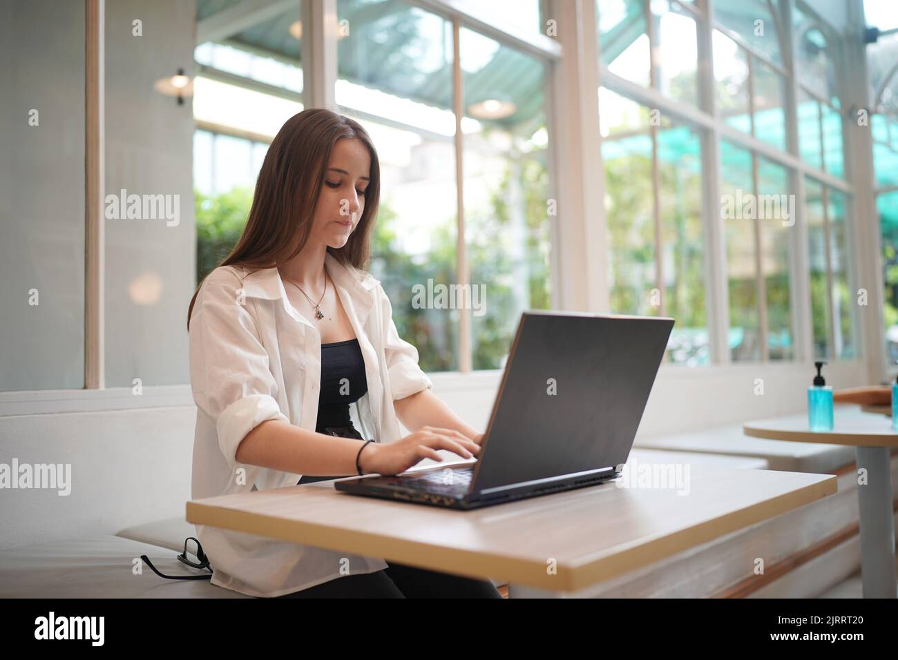 Women Using Desktop Technology and people concept, young woman using laptop and internet ...