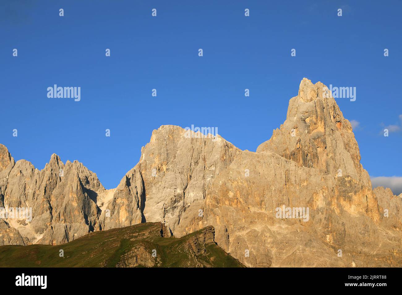 Breathtaking view of the Italian Dolomites with the peak called Cimon della pala and the orange color at sunset Stock Photo