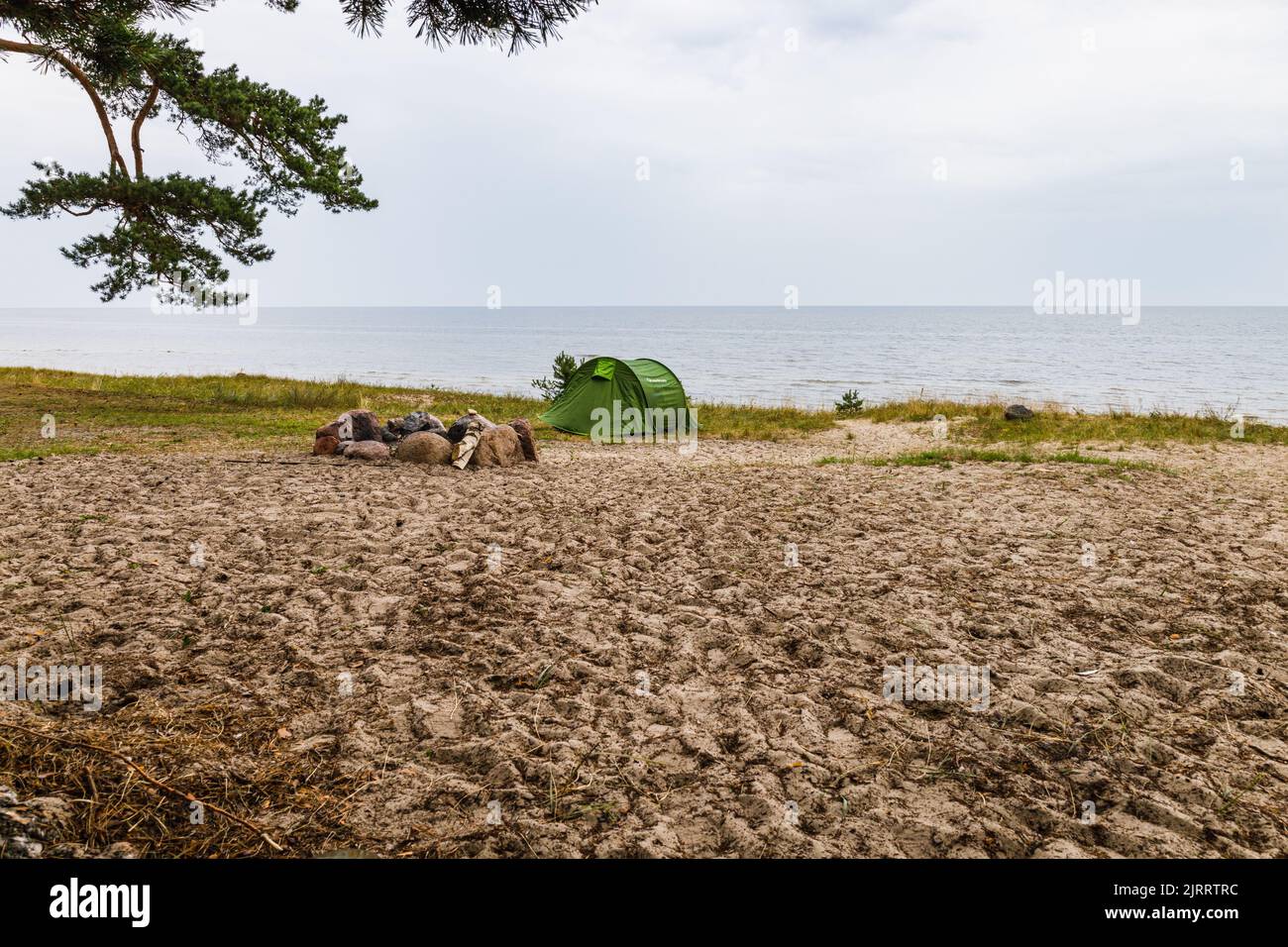 Fireplace and camping tent at the beach near the Baltic sea. Stock Photo