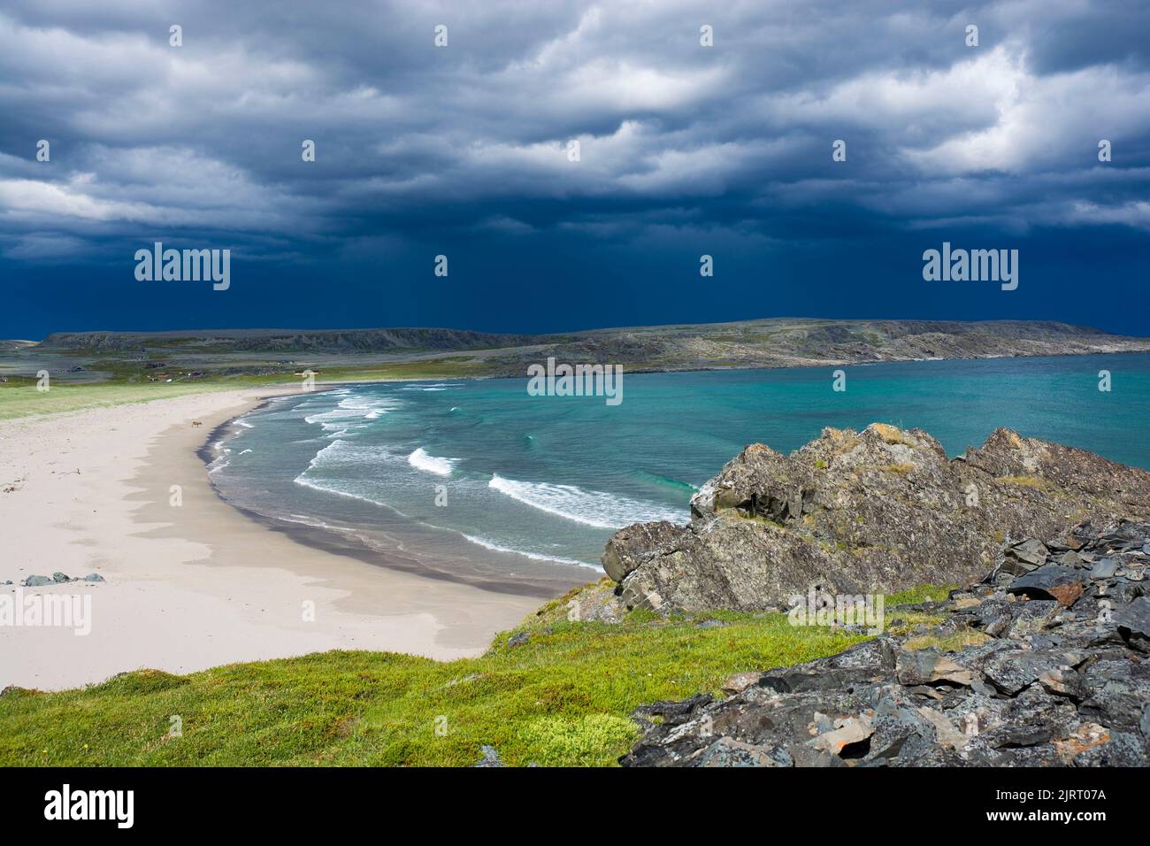 Stormy clouds over beautiful sandy beach in Sandfjordneset Nature Reserve, Norway Stock Photo
