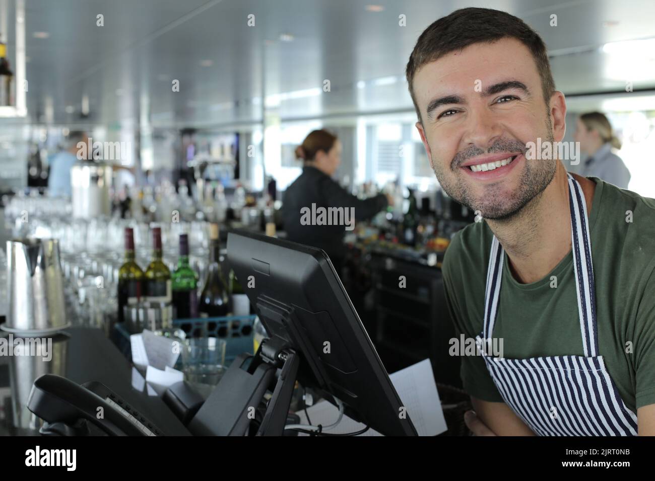 Restaurant cashier in front of computer Stock Photo