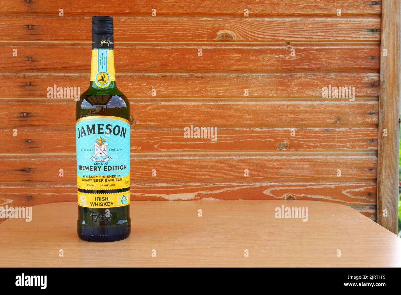 Bottle of Jameson Whiskey with wooden background Stock Photo