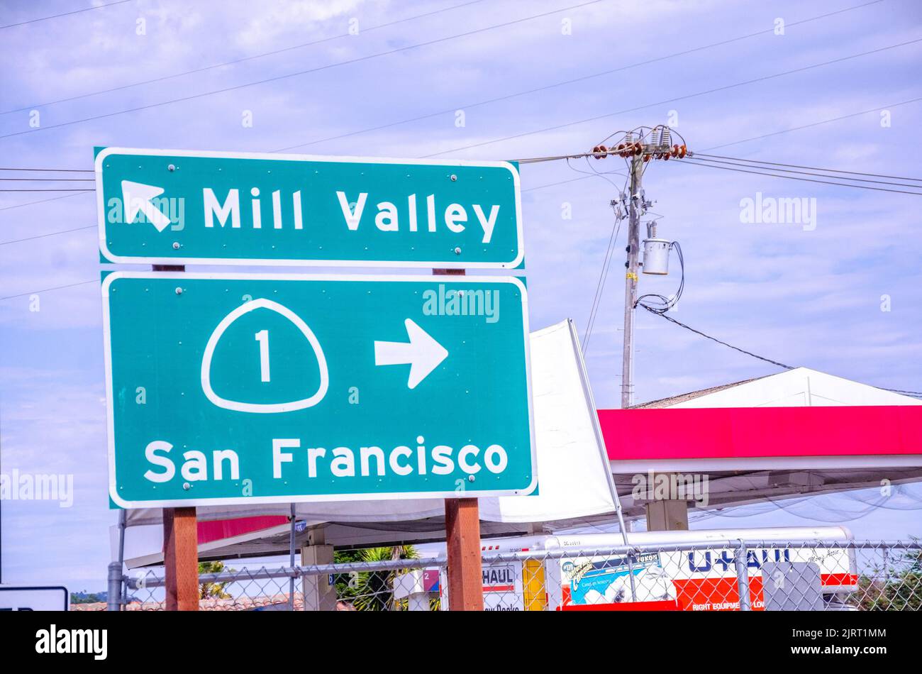 Large, green street signs in California, USA point out directions
