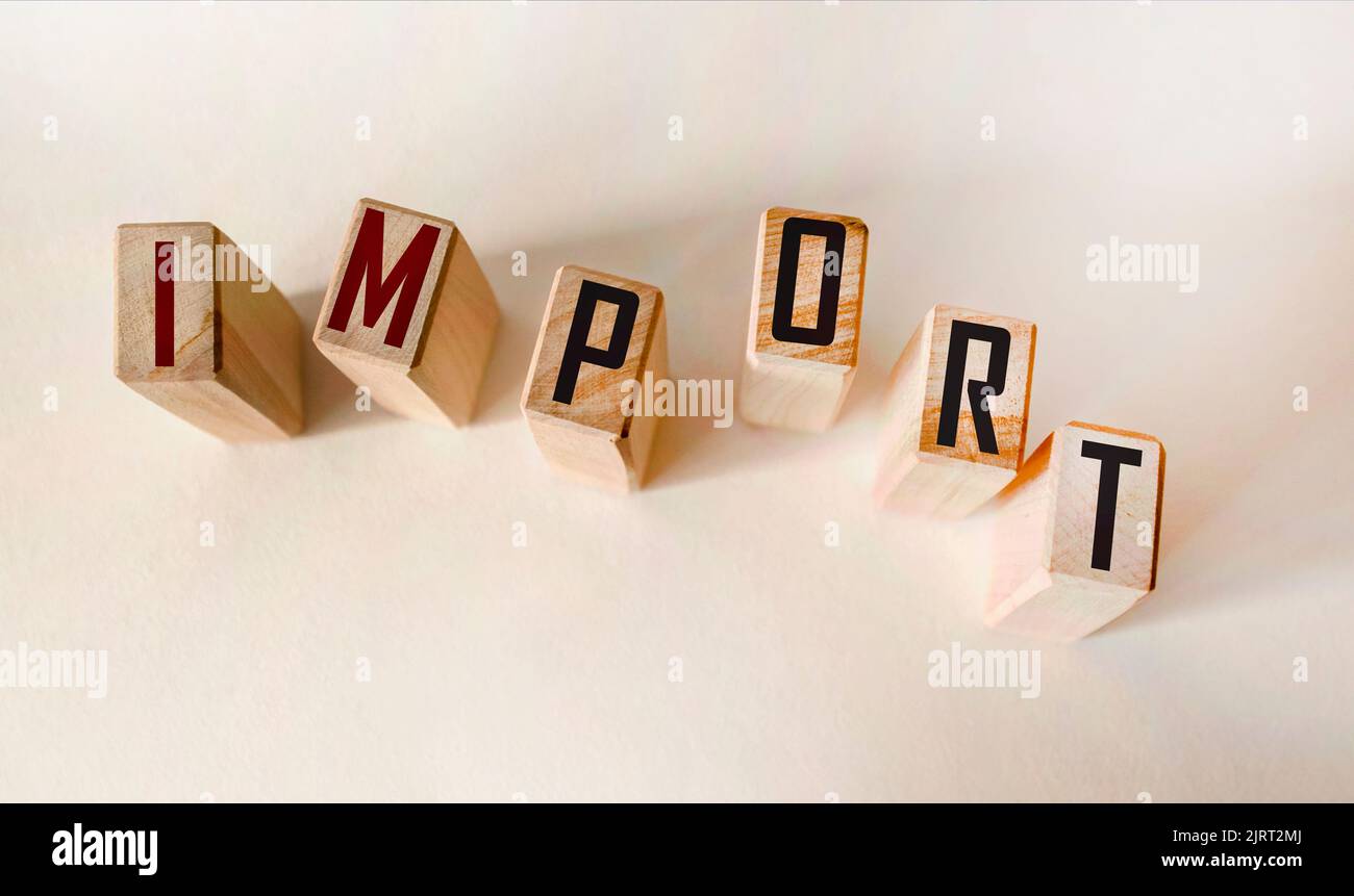 On a light table are wooden cubes with the inscription IMPORT. business concept Stock Photo