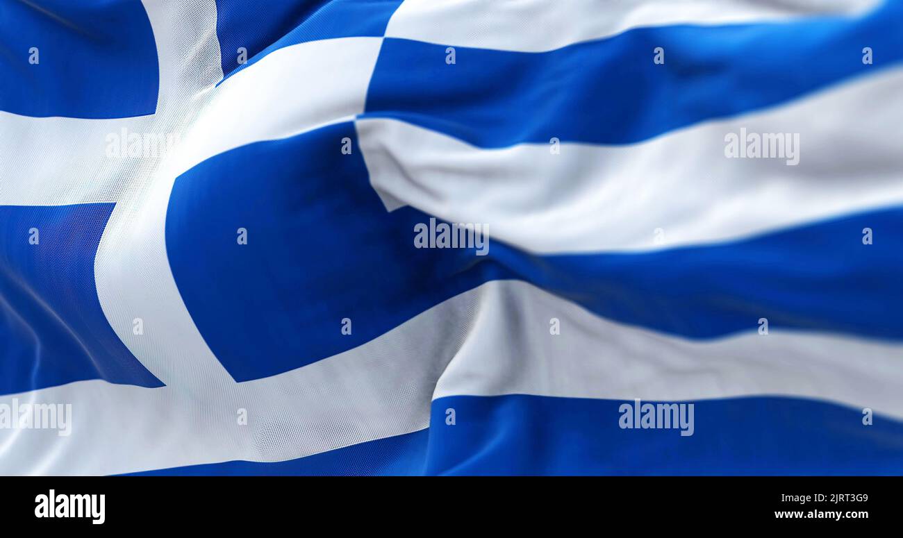Close-up view of the greek national flag waving in the wind. Greece is a country at the crossroads of Central and Southeast Europe. Fabric textured ba Stock Photo