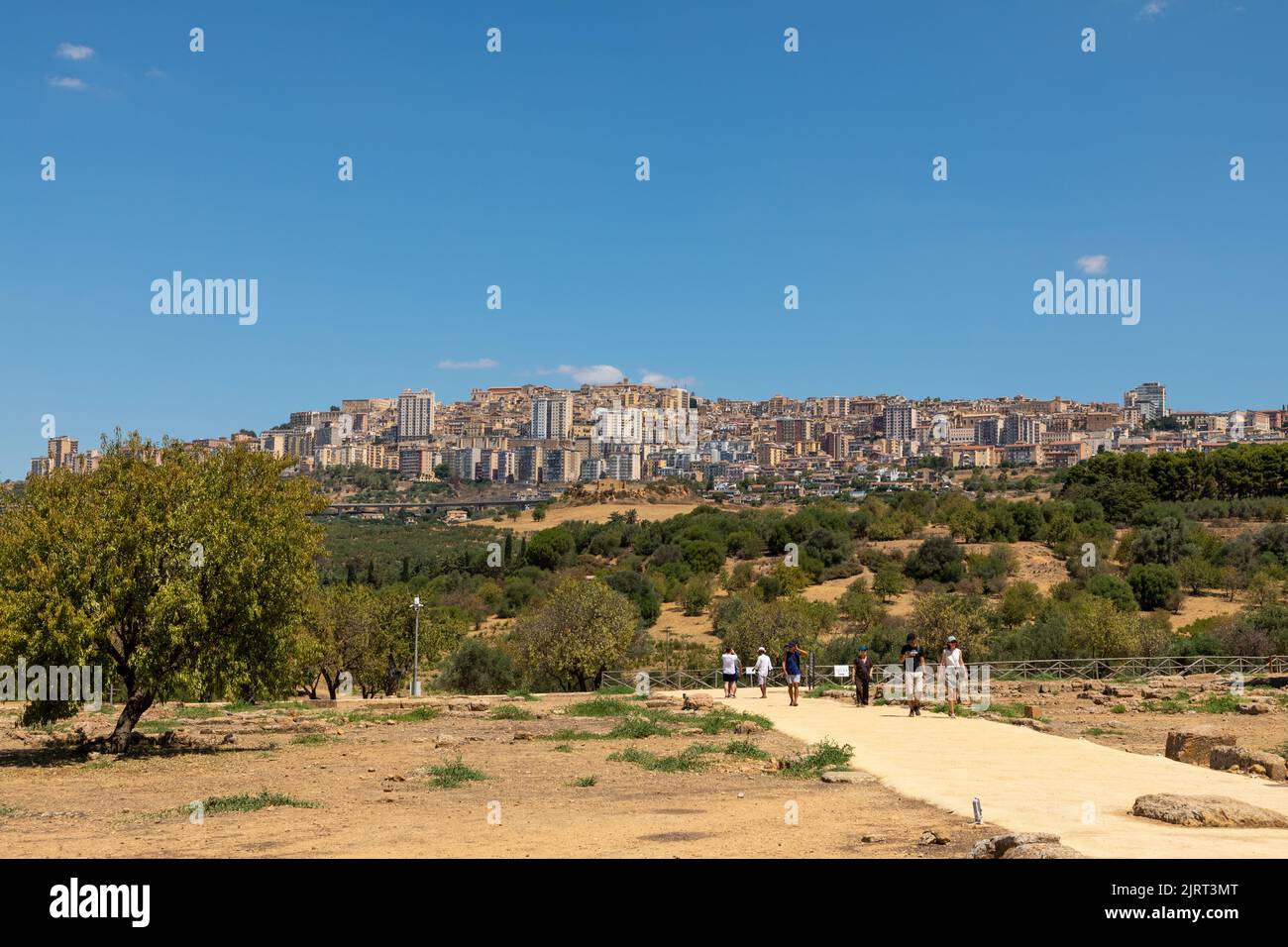 The hill top city of Agrigento overlooks the Valley of Temples archaeological site on Sicily, Italy. Stock Photo