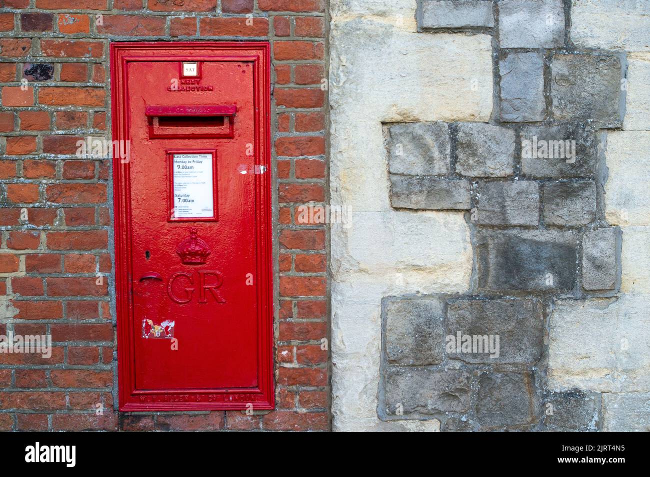 Windsor, Berkshire, UK. 26th August, 2022. A post box in the wall next to Windsor Castle has the collection date tab as Saturday. Over 115,000 Royal Mail postal workers were on strike today over pay and stoppages. Postal workers were picketing at the Queen Elizabeth Delivery Office in Windsor today. Mail is not being collected today and three further strike days are planned. Credit: Maureen McLean/Alamy Live News Stock Photo