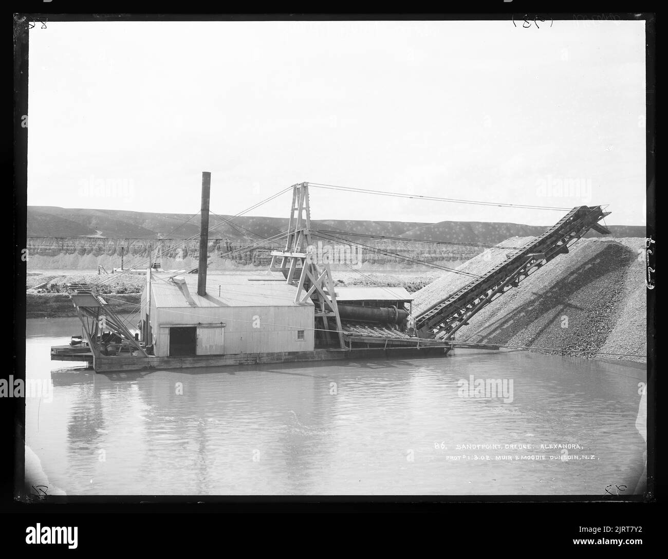 Sandy Point dredge, Alexandra, New Zealand, by Muir & Moodie. Stock Photo