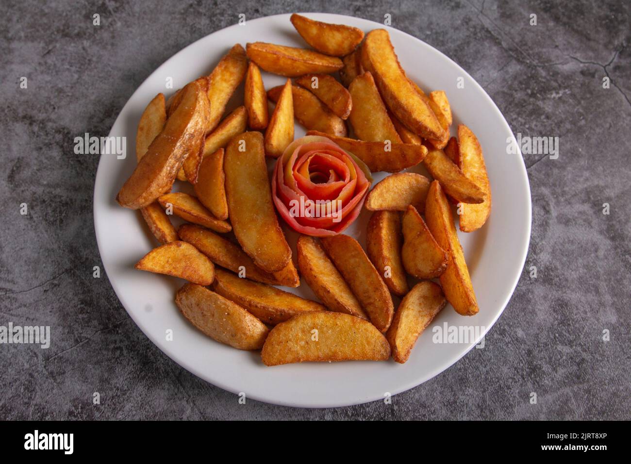 French fries de luxe on a rustic background Stock Photo