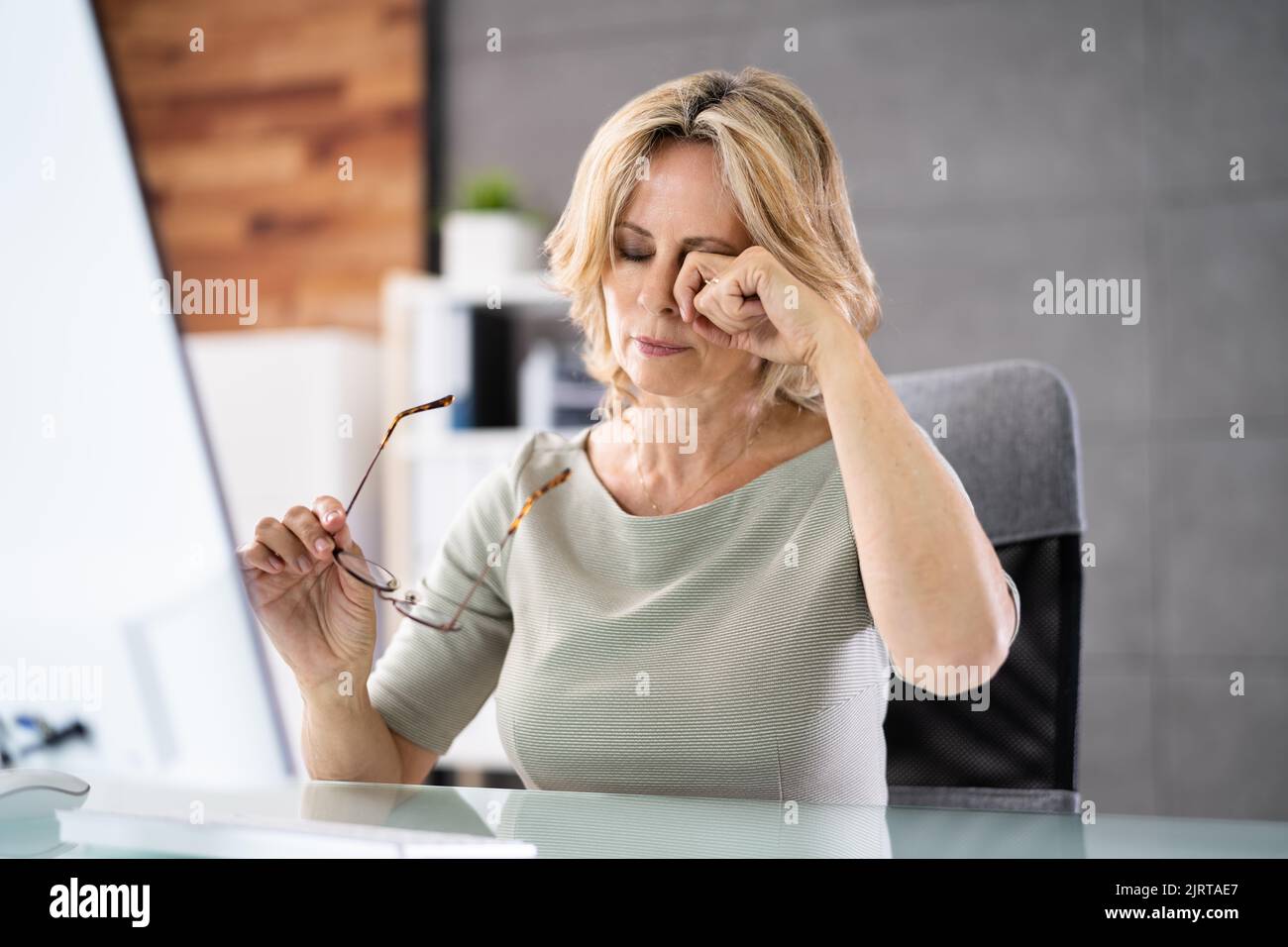 Woman Eye Fatigue And Pain. Tired Working On PC Stock Photo