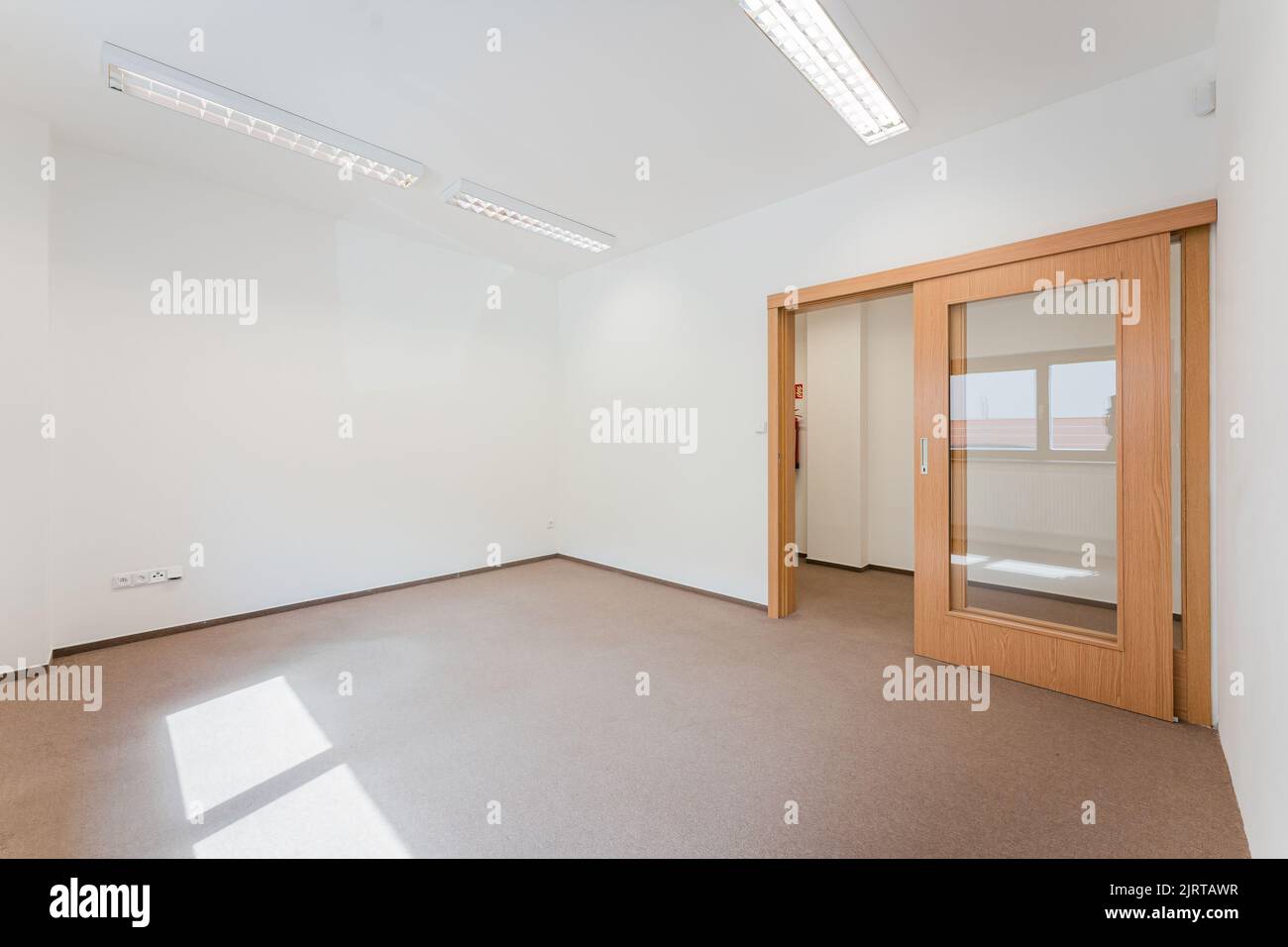An interior of an empty room with with white walls Stock Photo Alamy