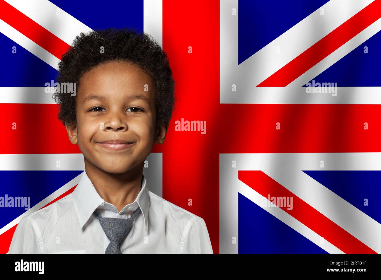 British kid boy on flag of United Kingdom background. Education and