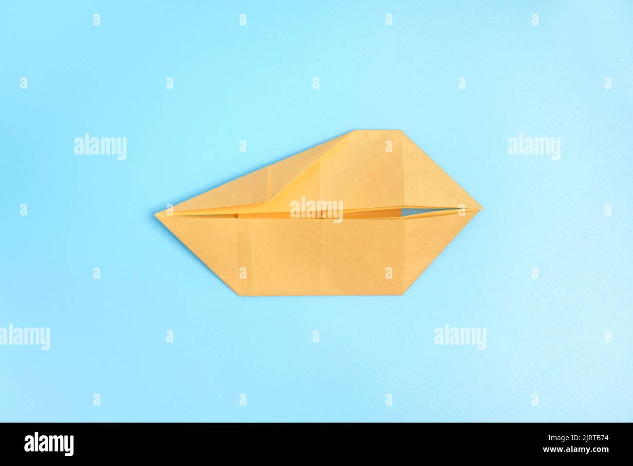 Origami Using Blue Steps Origami Bunny. Step-by-step photo instruction on a blue background ...