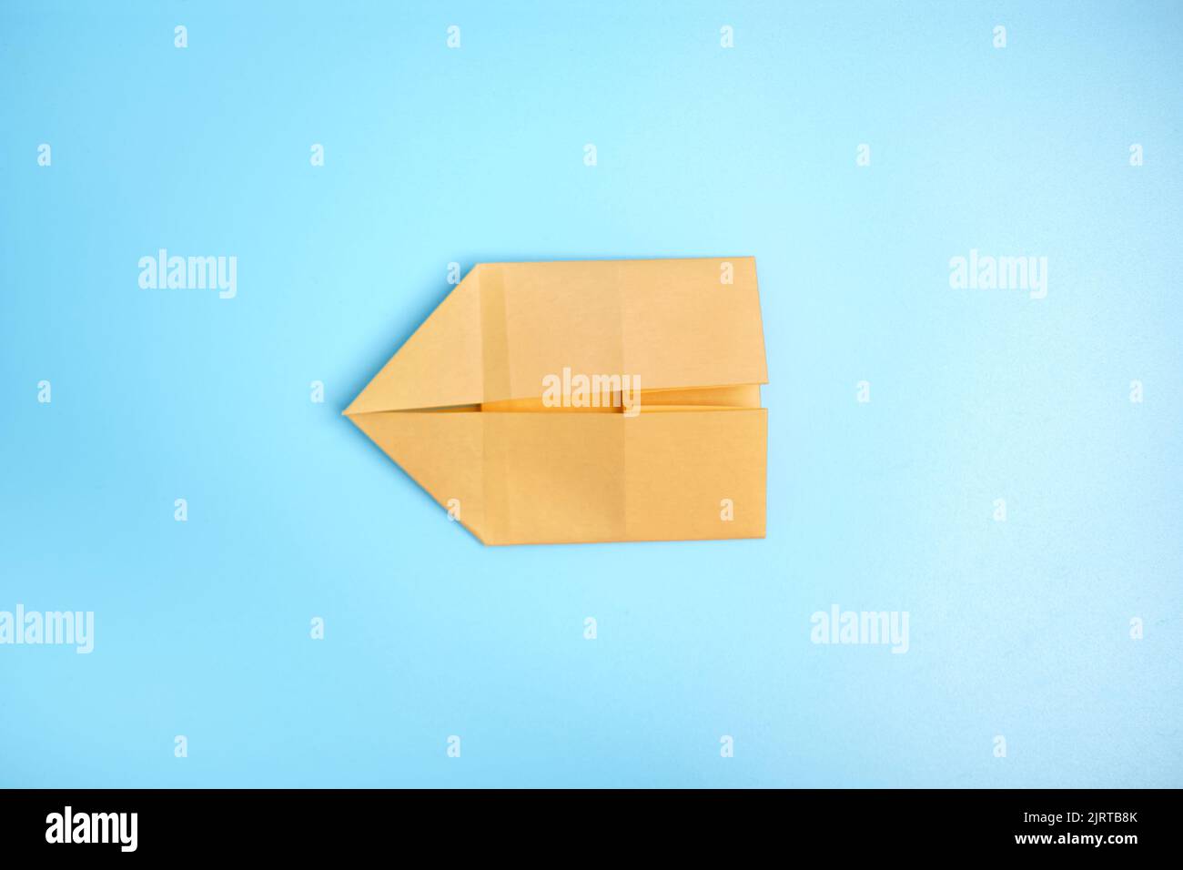 Origami Using Blue Steps Origami Bunny. Step-by-step photo instruction on a blue background ...