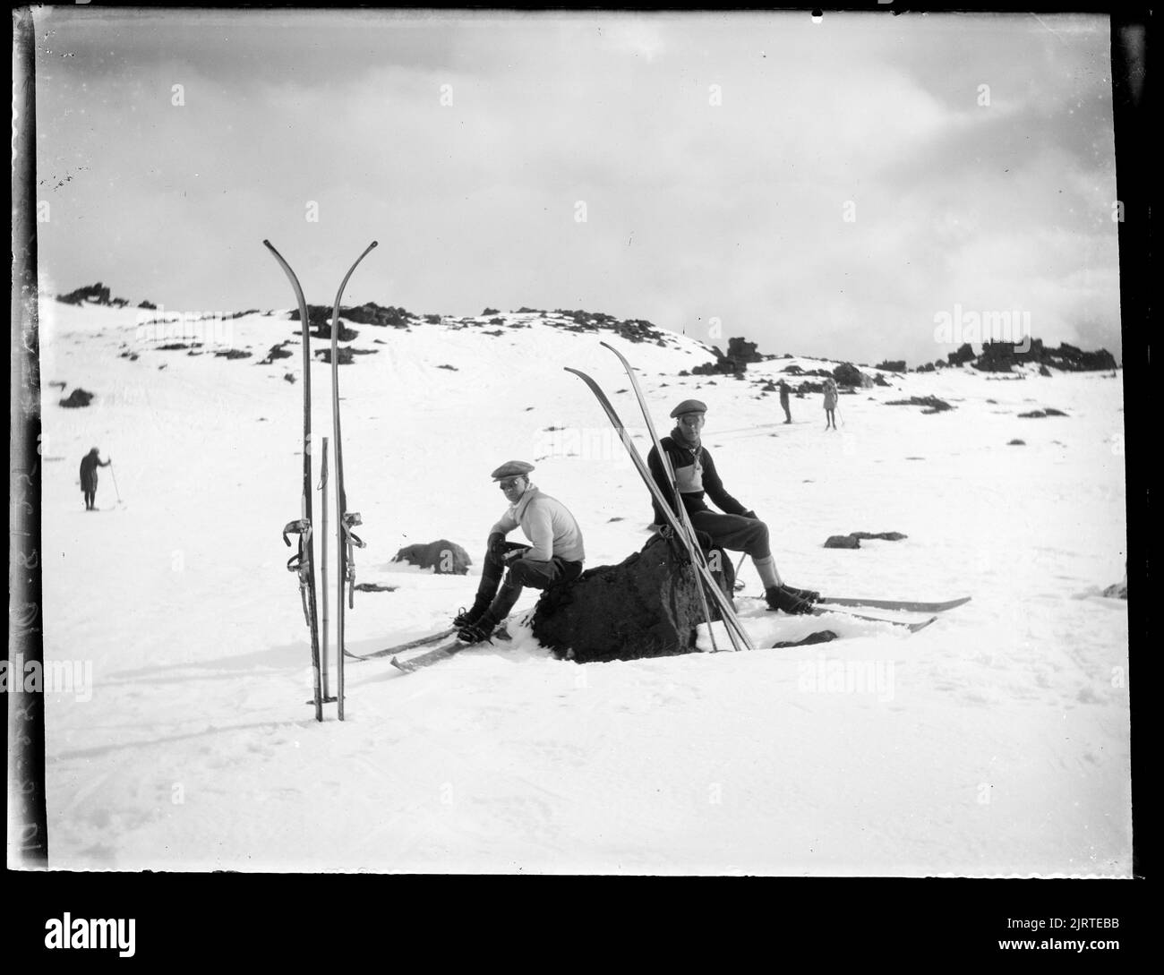 Family resting on rock Black and White Stock Photos & Images - Alamy