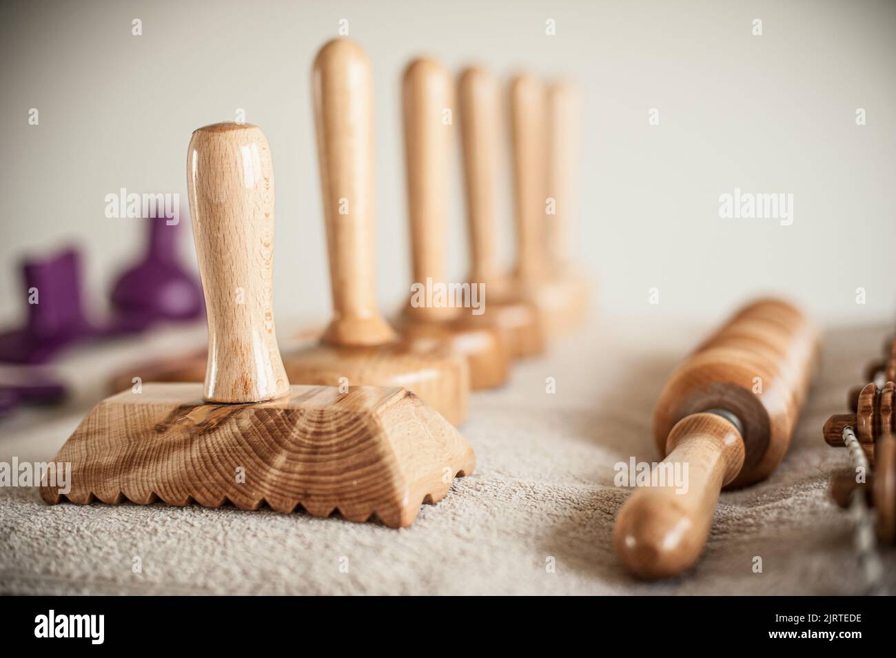 Wood massage, maderotherapy, wooden rolling pin or battledore tools for