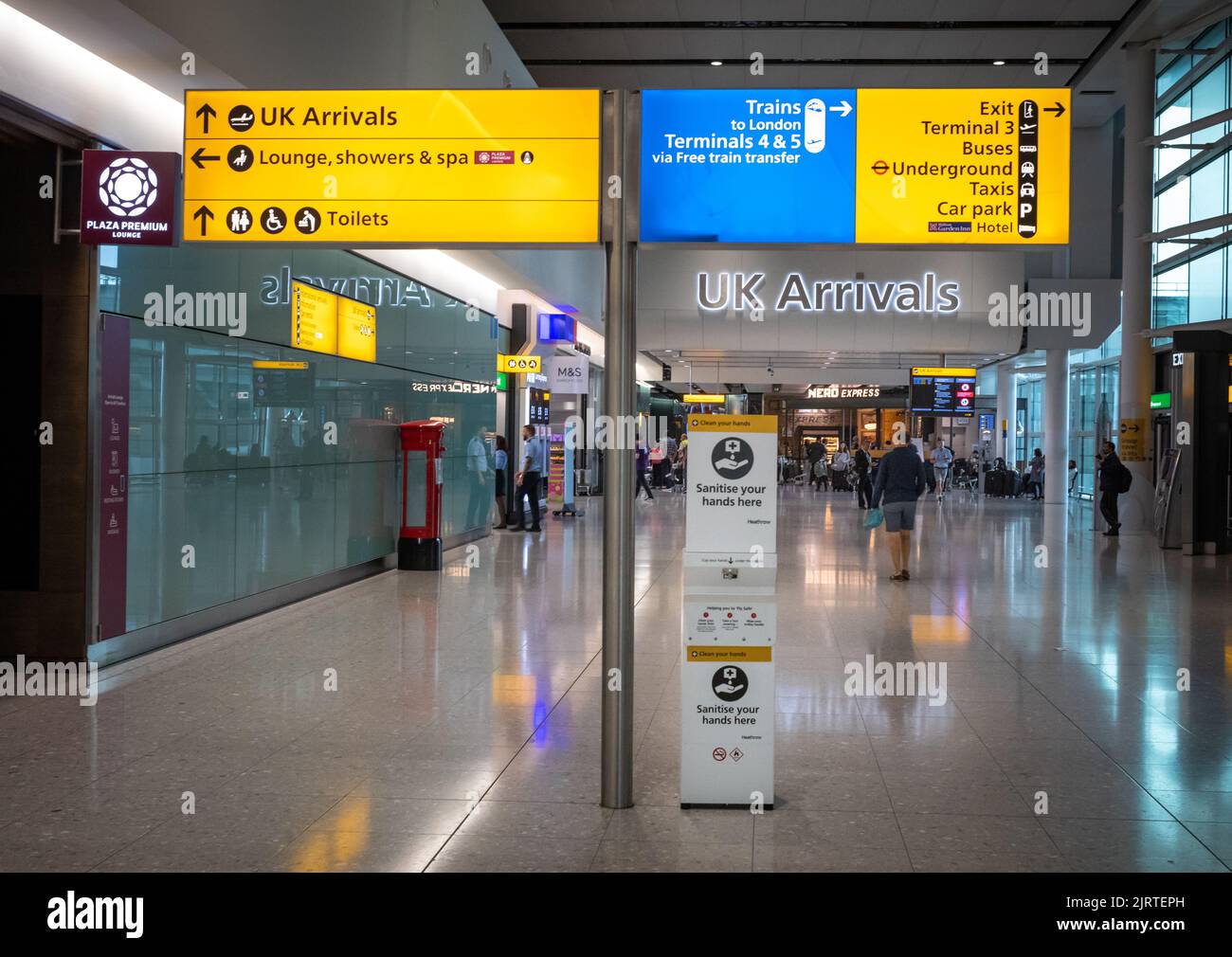 Passenger information signs in the arrivals hall at London Heathrow Airport, Terminal Two. Stock Photo