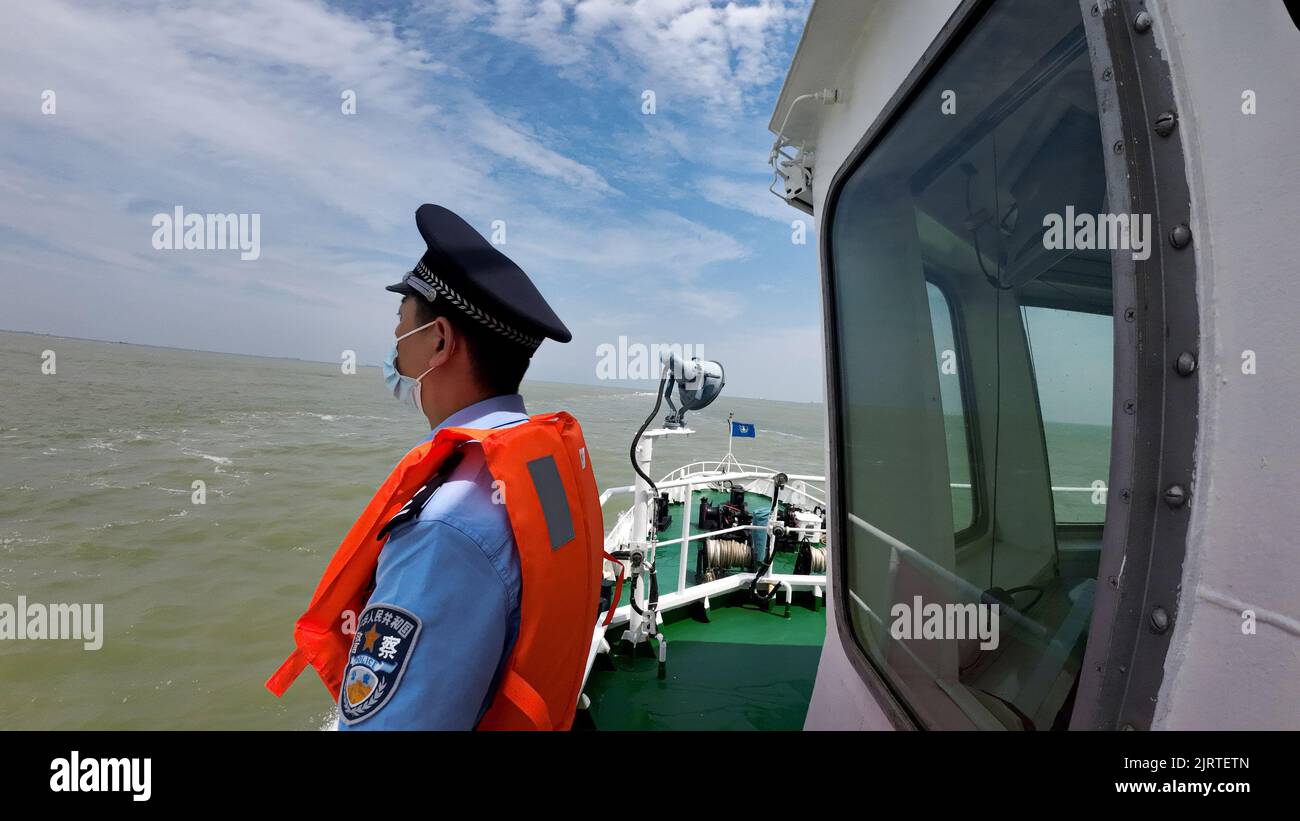 DONGYING, CHINA - AUGUST 26, 2022 - Patrol boats are seen under sail in Dongying city, Shandong province, China, Aug 26, 2022. Shandong Dongying Entry Stock Photo