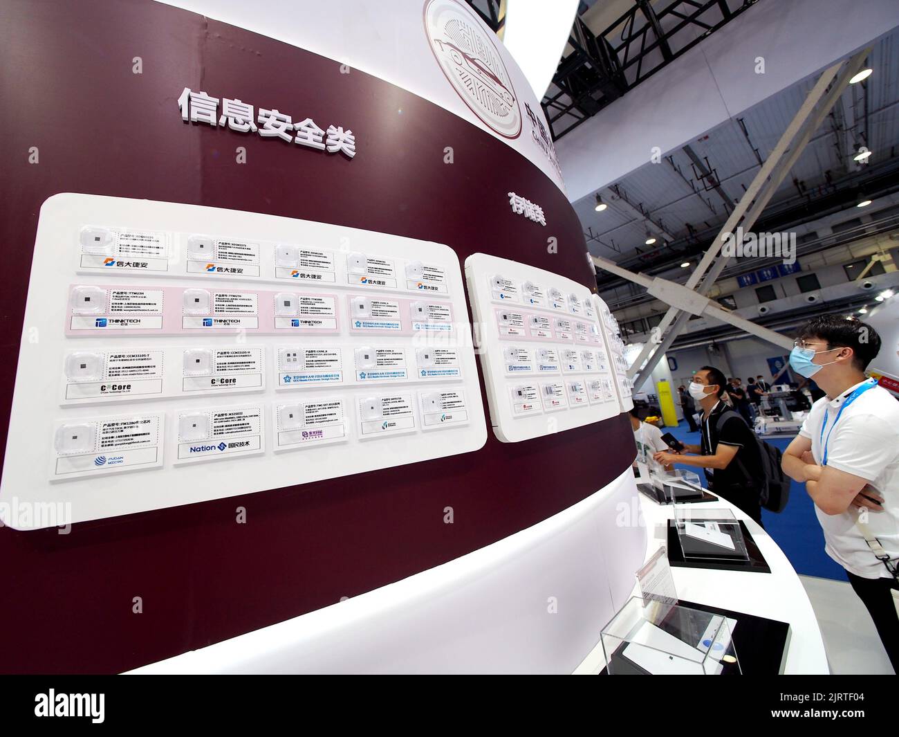 BEIJING, CHINA - AUGUST 26, 2022 - Visitors view domestic automotive chips at China Core's booth during the '2022 World New Energy Vehicle Congress' a Stock Photo