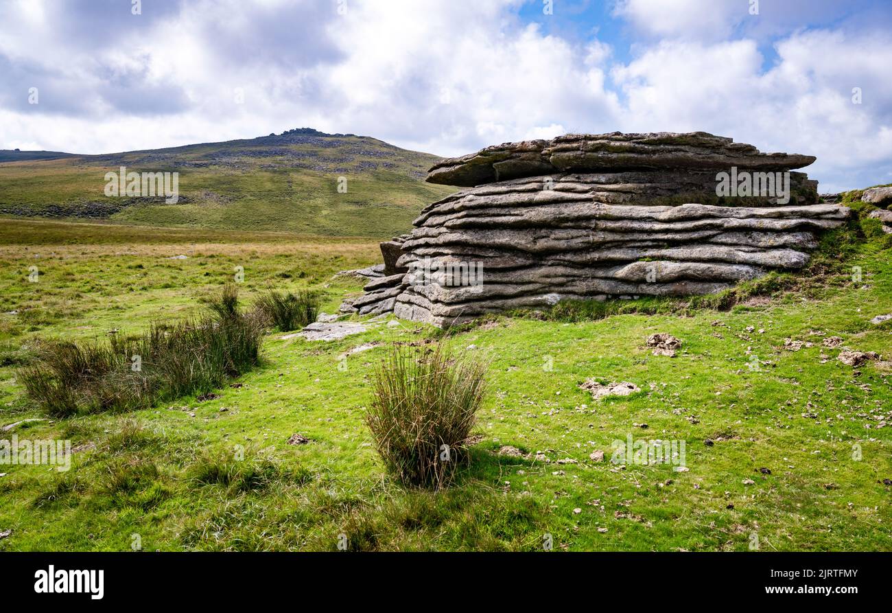 Detail of granite outcropping on West Mill Tor with Yes Tor in the distance.  Dartmoor National Park, Devon, UK. Stock Photo