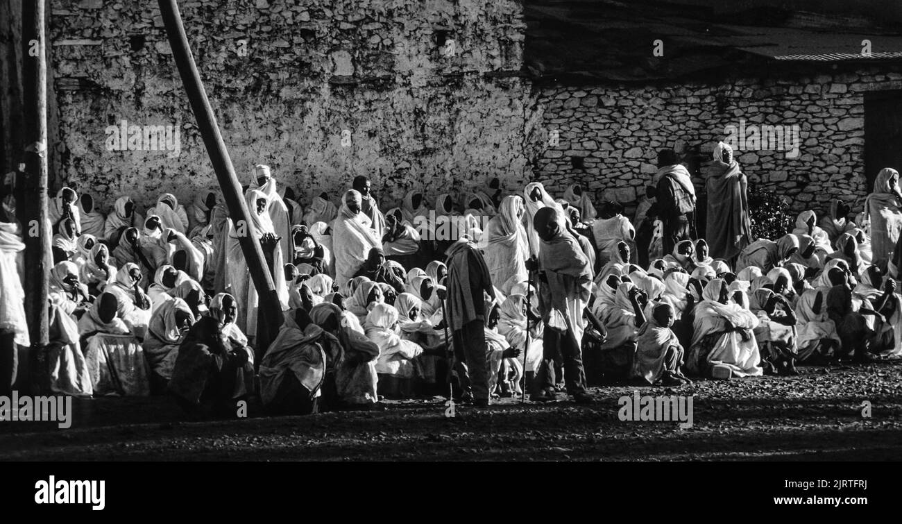 Axum, Ethiopia - July 1, 1998: people watch the ceremony of the holy ark  through the streets in Axum, Ethiopia. The ark was stolen in Salomons temple Stock Photo