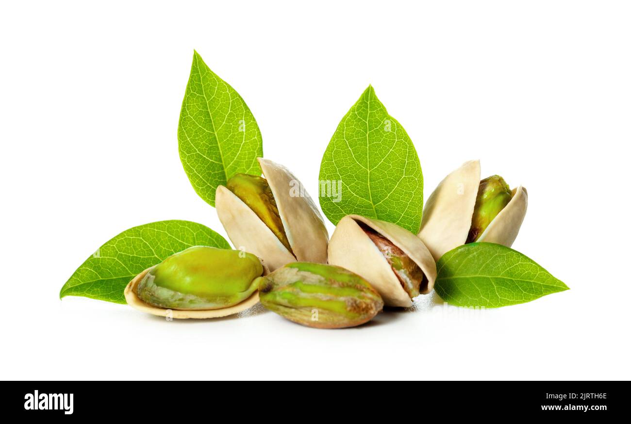 pistachio nuts with leaves isolated on white background Stock Photo