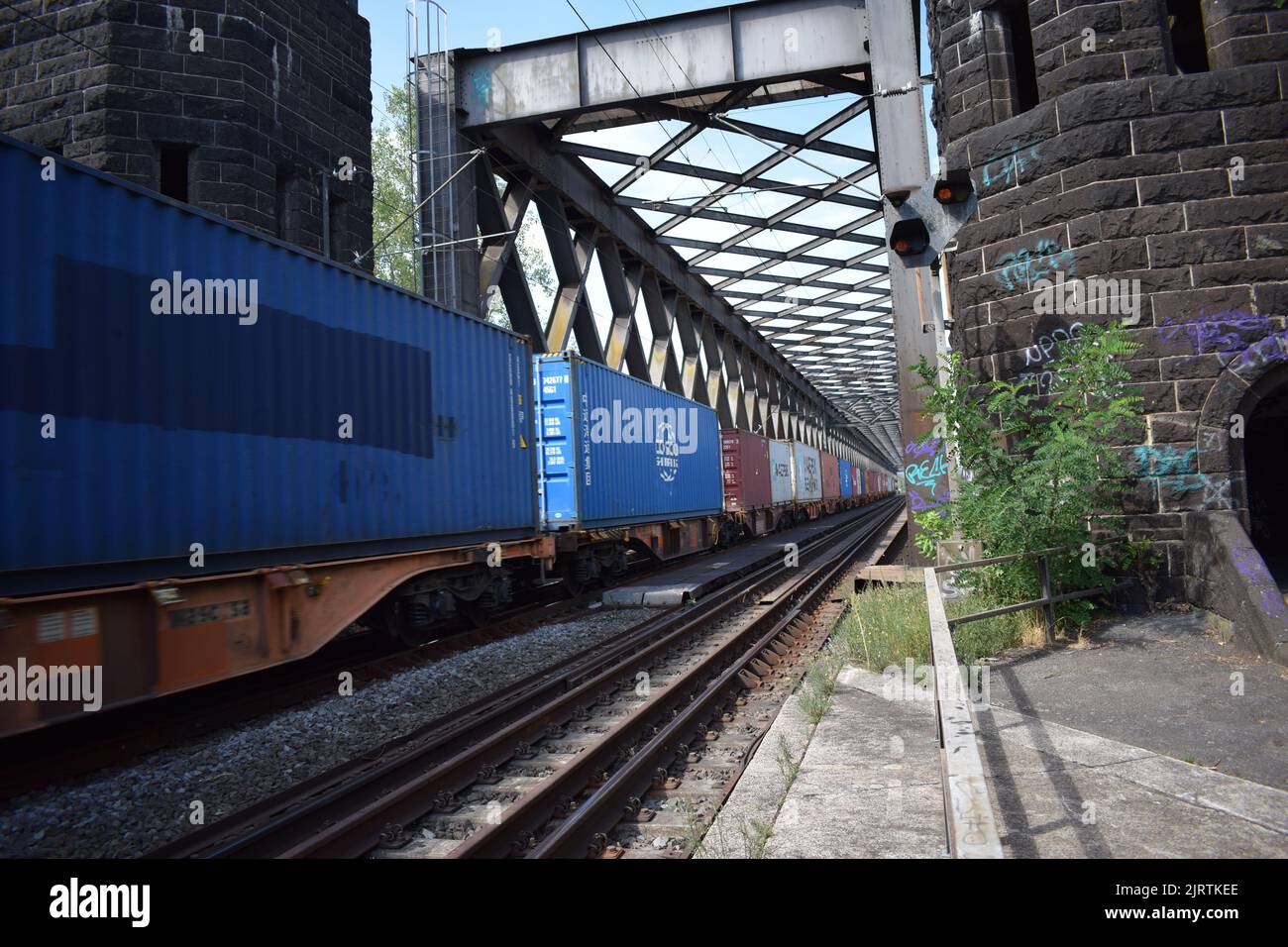 freight train running across the old railroad bridge near Urmitz and
