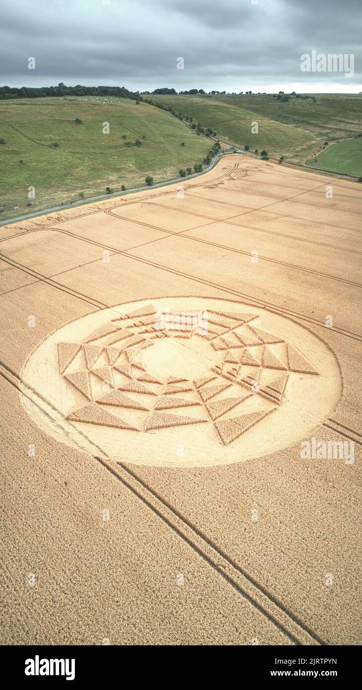 An aerial view of crop circles in a vast agricultural field in the countryside of Wiltshire, England Stock Photo