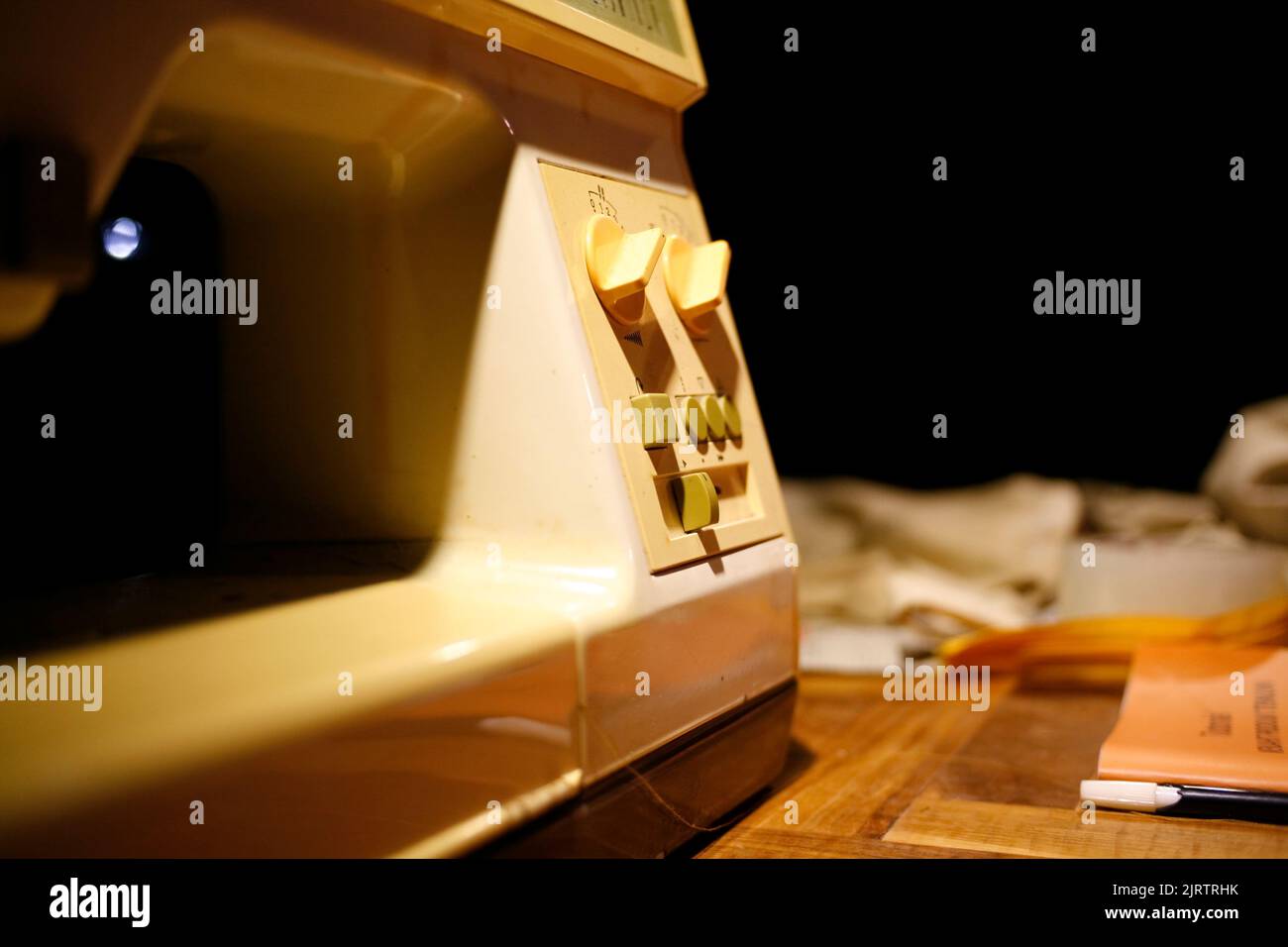Sewing machine on table in tailor's Stock Photo Alamy
