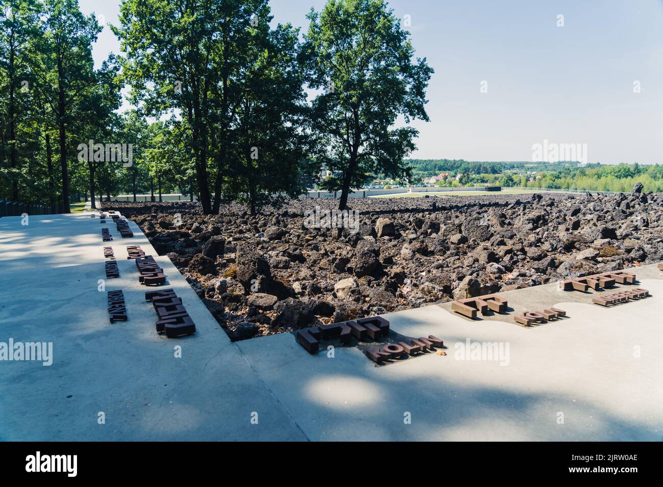 08.27.2022 - Belzec, Poland - Belzec Nazi Death Camp. Stone ruins on former nazi death camp ground. Hebrew writing on concrete paths. Holocaust memorial. Horizontal shot. High quality photo Stock Photo