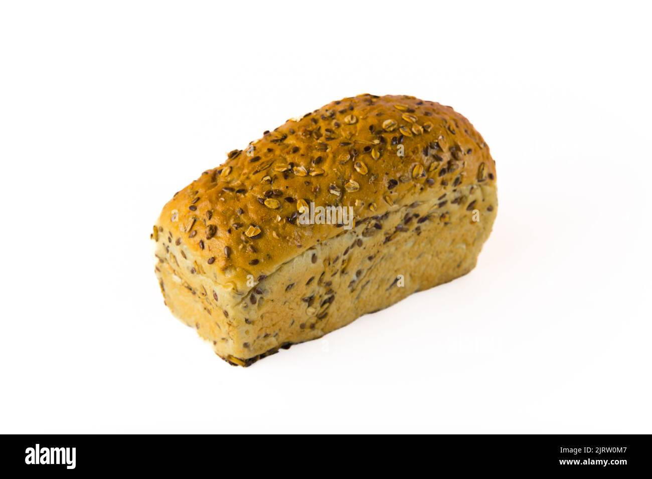 Uneven tasty freshly baked loaf of whole grain bread with oats and