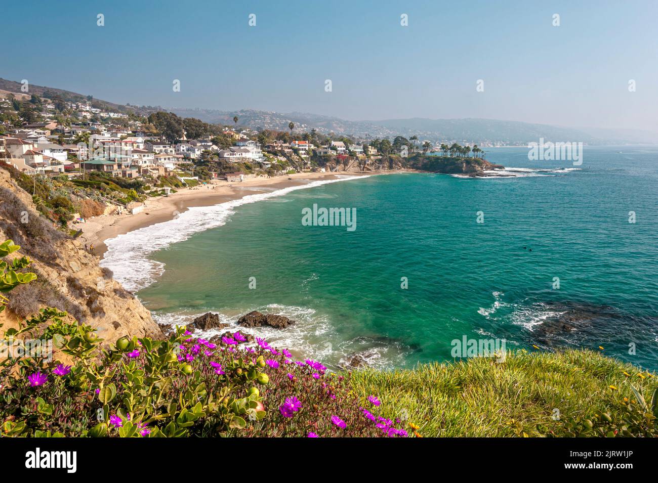 A view of Shaw's Cove in Laguna Beach as the morning marine layer burns off and lights the cove. Stock Photo
