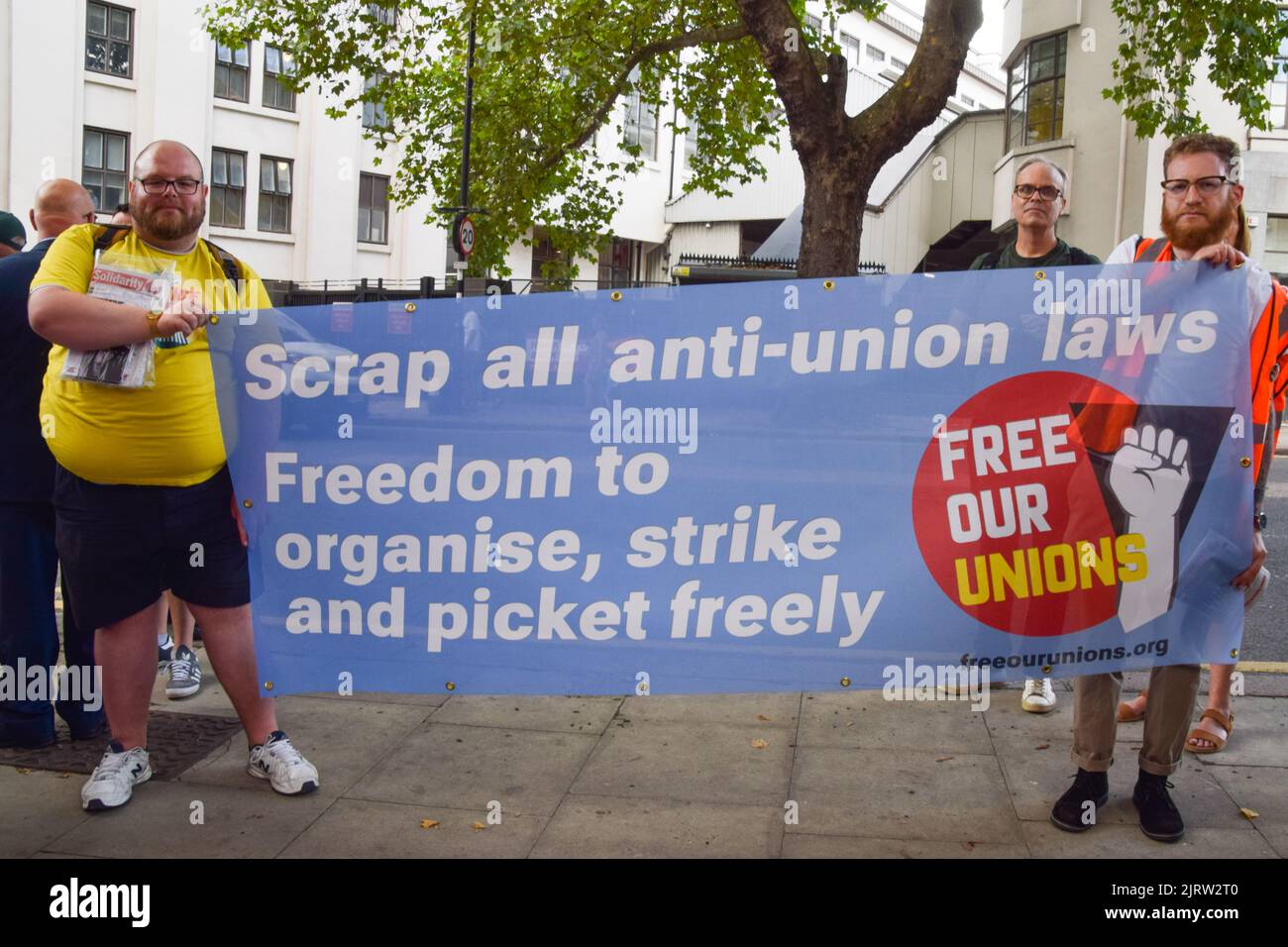 London, England, UK. 26th Aug, 2022. Protesters hold a banner calling for all anti-union laws to be scrapped. CWU (Communication Workers Union) members, Royal Mail and Post Office workers, and supporters staged a rally outside the Mount Pleasant Mail Centre as thousands of Royal Mail and Post Office workers across the UK begin their strike over pay. (Credit Image: © Vuk Valcic/ZUMA Press Wire) Stock Photo