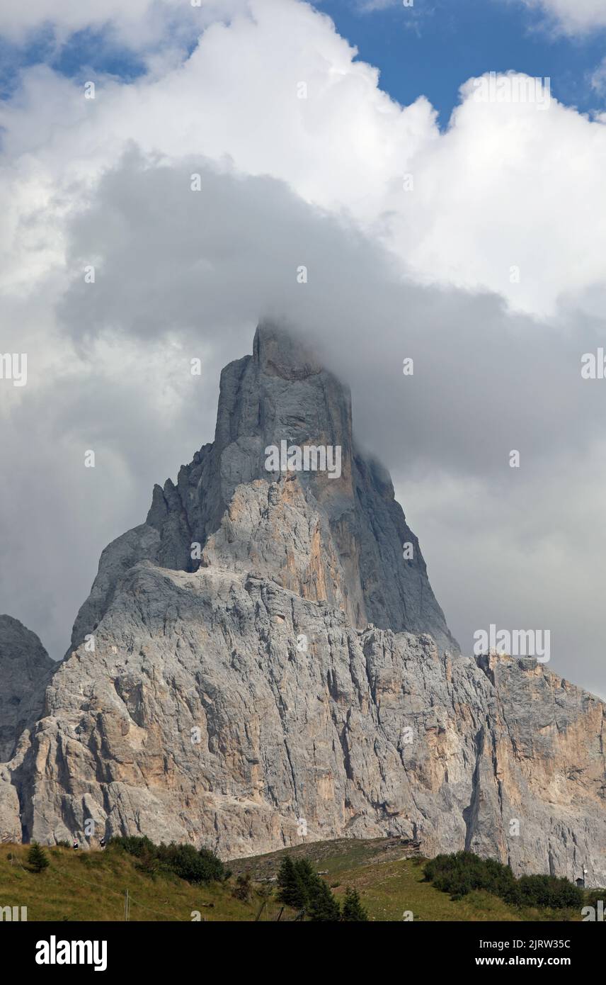 Mountain called Cimon della Pala with white clouds in the Italian Dolomites Stock Photo