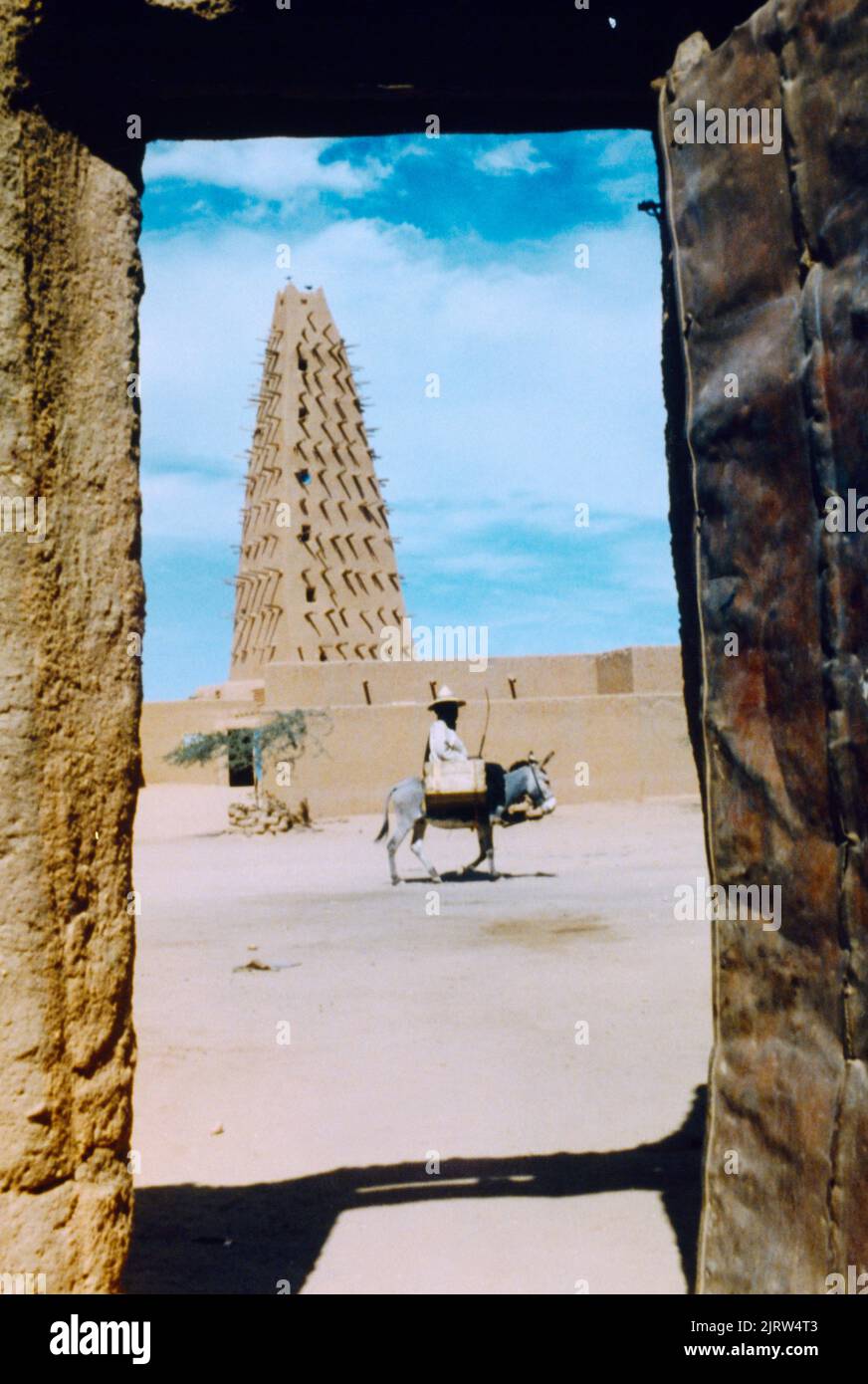 Agadez Niger Grand Mosque Minaret (Tallest Mudbrick Minaret in the World) Man on Donkey Stock Photo