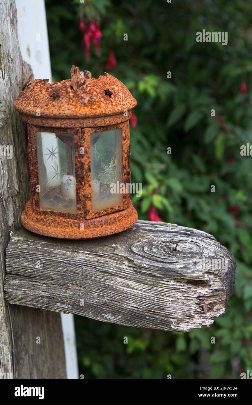 Rusted Lantern on a Wooden Beam, Old Lantern, Ancient Lantern, Rusty Lamp, Still Life Stock Photo