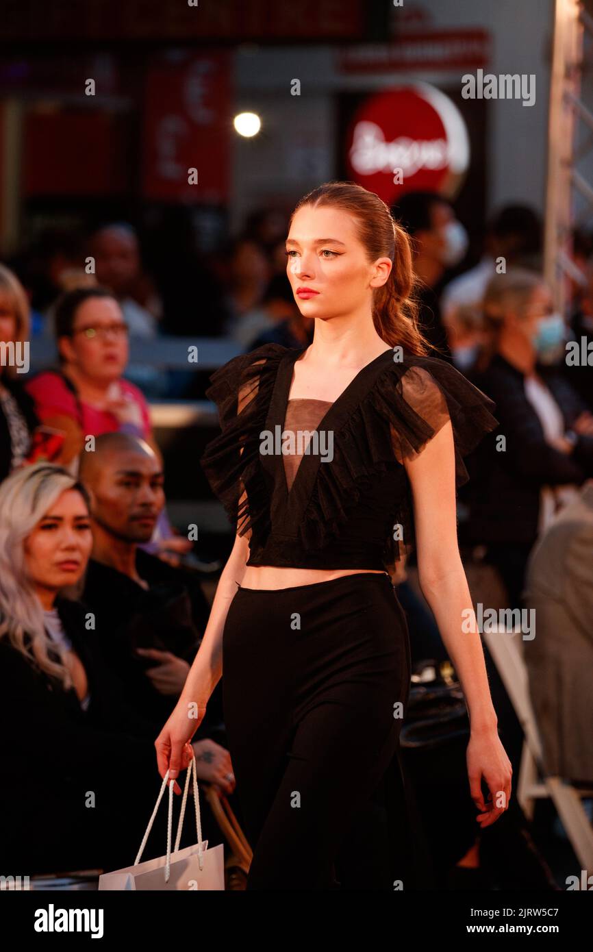 Models walk a fashion runway wearing brands from local and international designers and retailers