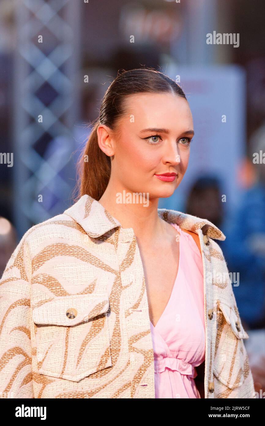 Models walk a fashion runway wearing brands from local and