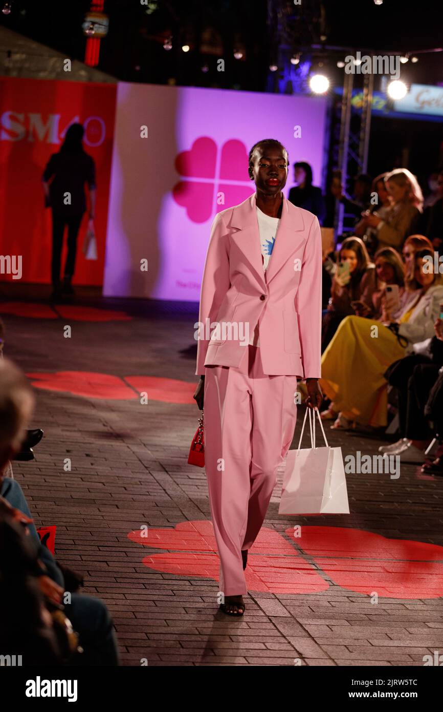 models-walk-a-fashion-runway-wearing-brands-from-local-and