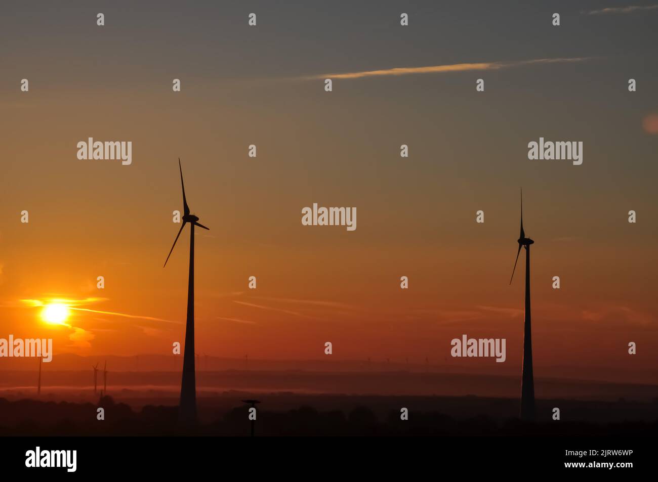Wind mill and sun rise Stock Photo