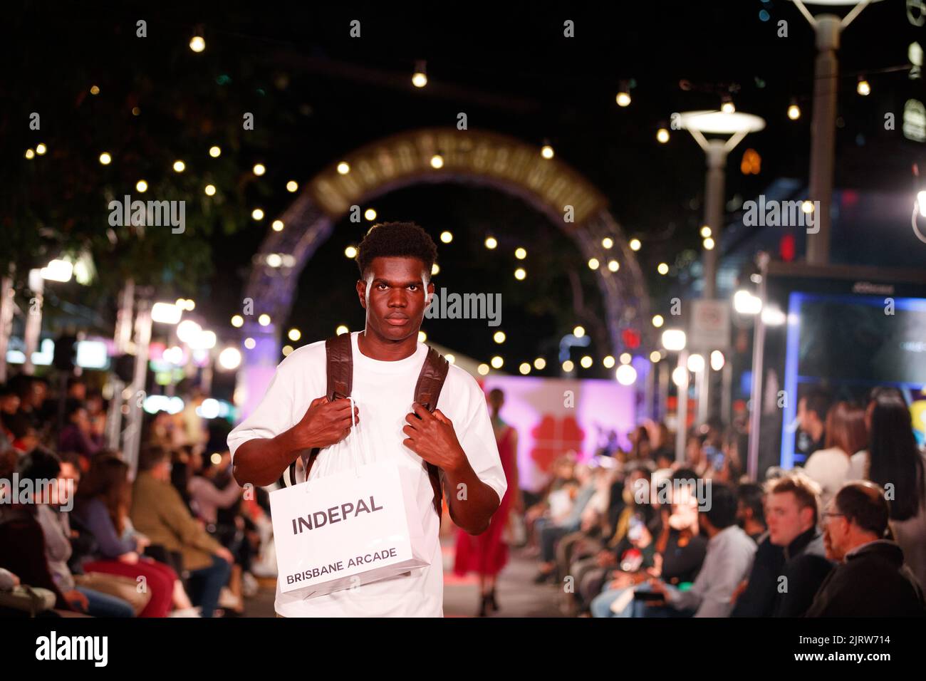 Models walk a fashion runway wearing brands from local and