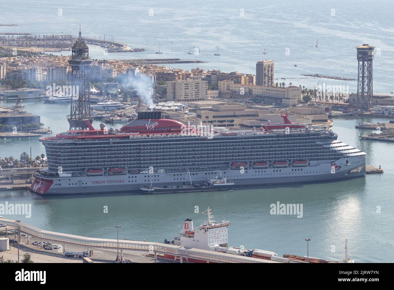 BARCELONA, SPAIN-JULY 17, 2022: Valiant Lady cruise ship by Virgin Voyage in the Barcelona Cruise Port.  Aerial view. Stock Photo