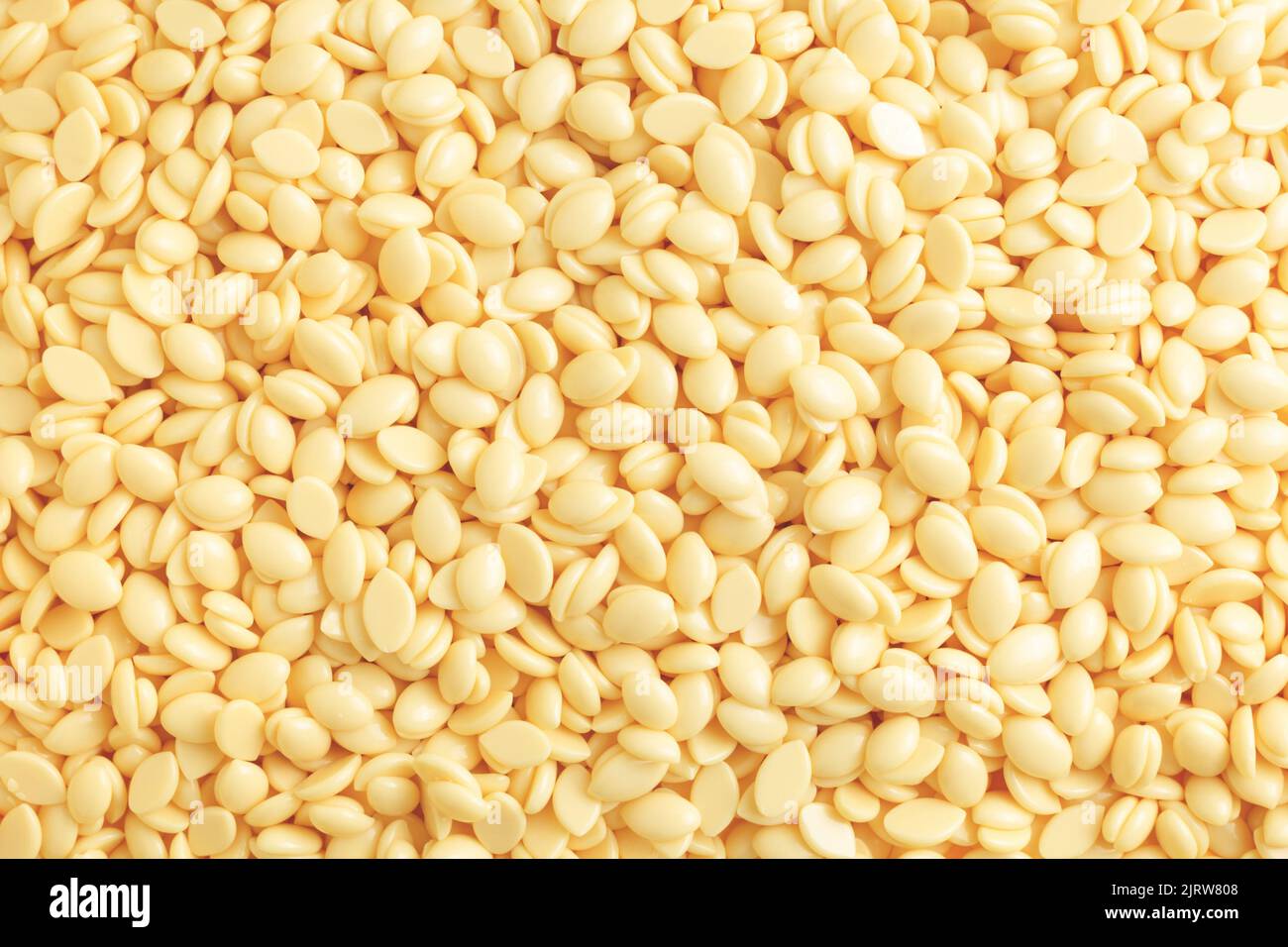 Natural depilatory wax bean granules. Texture background, hair removal