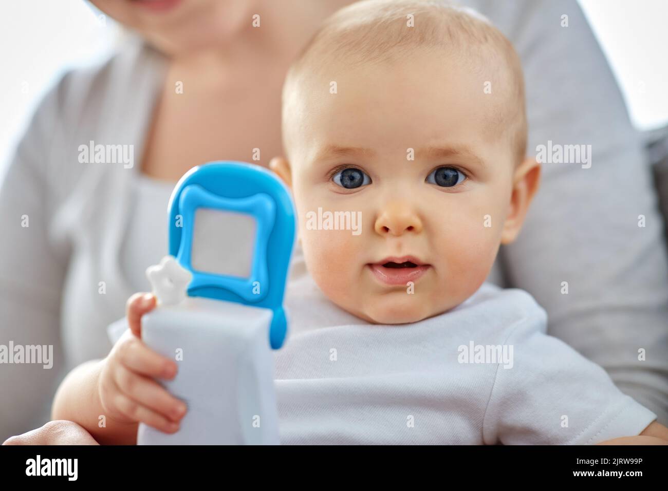 mother with baby playing with toy phone at home Stock Photo - Alamy
