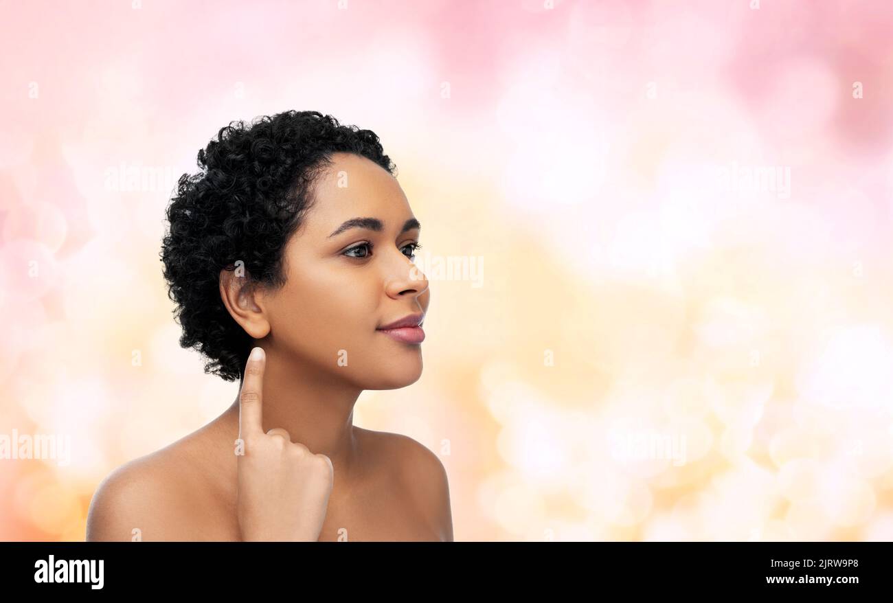 african american woman showing her ear Stock Photo