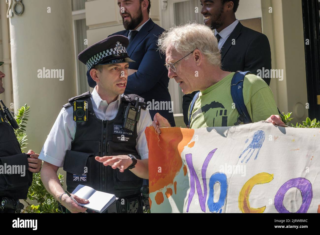 London, UK. 26th Aug, 2022. Police harass Phulbari Solidarity Group at the vigil at the Bangladesh High Commission on the 16th anniversary of the Phulbari Massacre. 3 people were shot dead at a huge non-violent protest against London mining company GCM's plans to forcibly displace 130,000 people and open cast mine 572 million tons of coal over 30 years. GCM still sells shares on the London Stock Exchange despite having no contract to mine. Credit: Peter Marshall/Alamy Live News Stock Photo