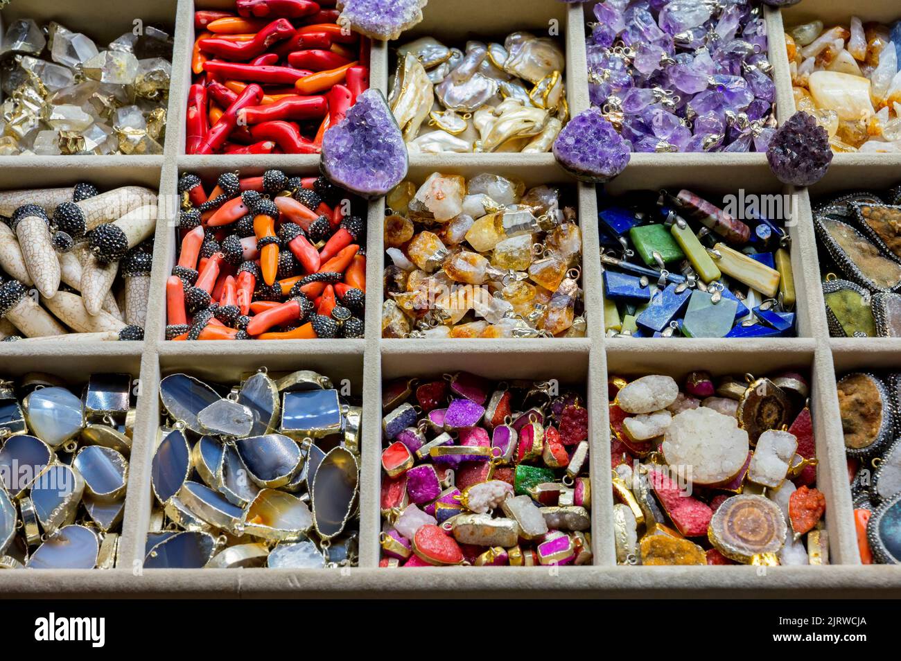 ISTANBUL TURKEY, January 2022. Different souvenirs made of semi-precious orornamental stones at the Grand Bazaar such as neck pendants and bracelet ch Stock Photo